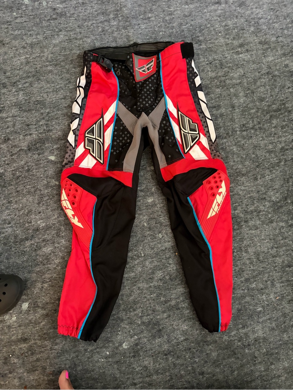 Youth Motocross Pants in Red and Black with Blue Accents